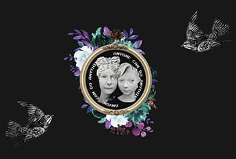 A screen shot of a webpage displaying two women statue heads framed above a bouquet of flowers, with the text Anyone can do Anything spinning around the statues.
